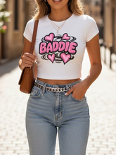 Load image into Gallery viewer, WOMEN'S "BADDIE" WHITE GRAPHIC CROP TOP IN STORES